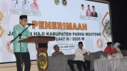 Bupati Parigi Moutong Erwin Burase menyampaikan sambutannya saat menerima kedatangan jamaah haji asal kabupaten itu berlangsung di Parigi, Kamis (25/6/2026). Foto:HO-Humas Pemkab Parigi Moutong